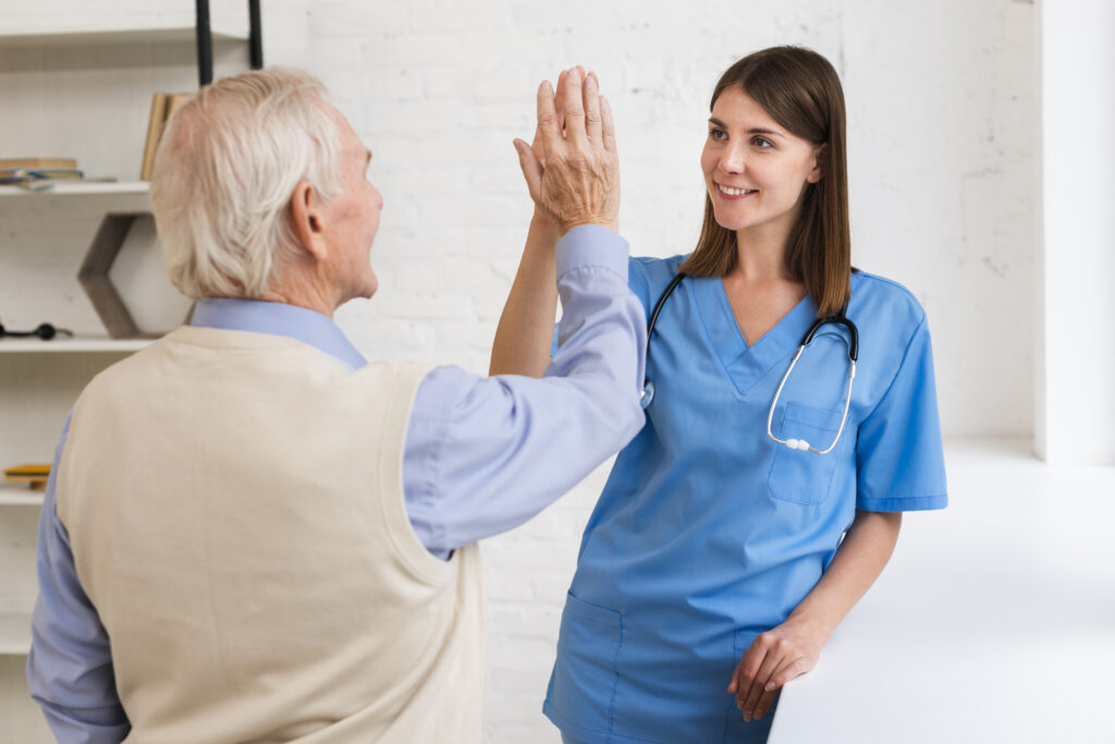 caregiver-high-fiving-with-old-man